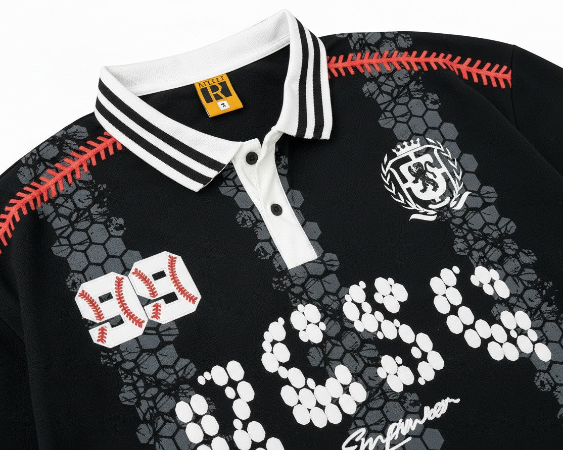 PAKSHI black long sleeve polo with white striped collar, baseball-themed graphic prints, and crest detail.
