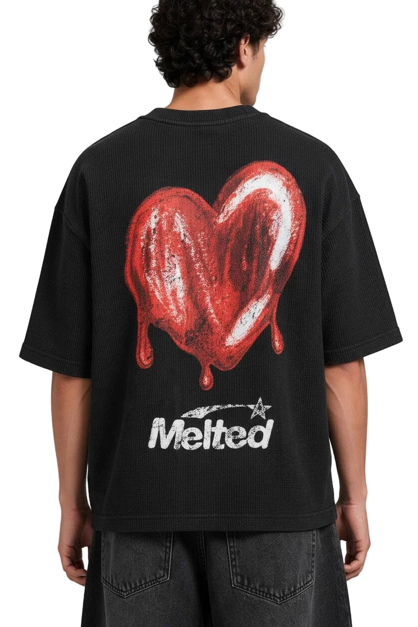 PAKSHI black waffle knit t-shirt featuring a large red melted heart graphic and Melted text on the back