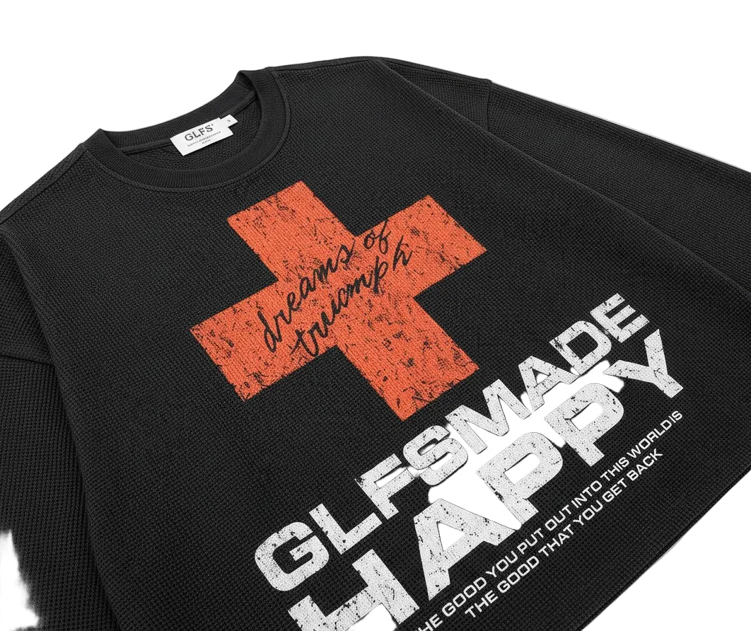 PAKSHI black waffle knit long-sleeve t-shirt with a red cross graphic and white distressed typography
