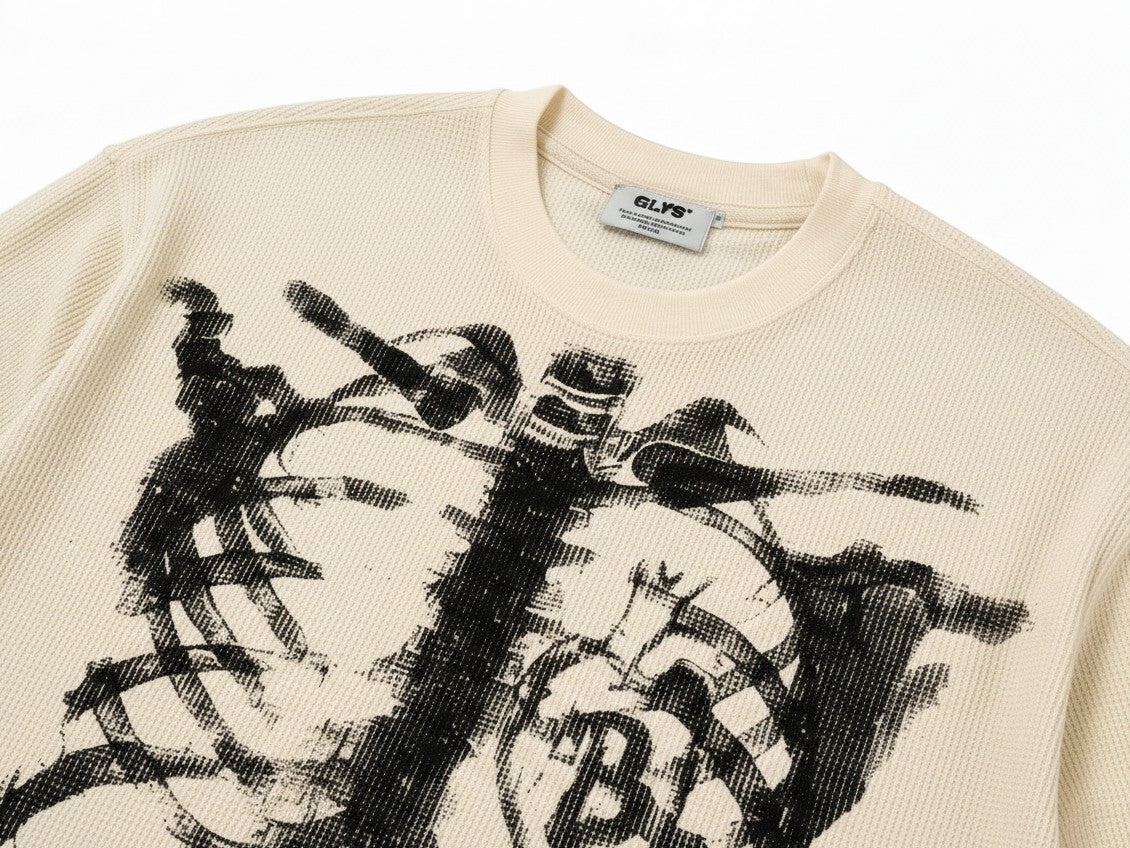 PAKSHI cream waffle knit long-sleeve t-shirt with a black distressed skeleton graphic print on the chest