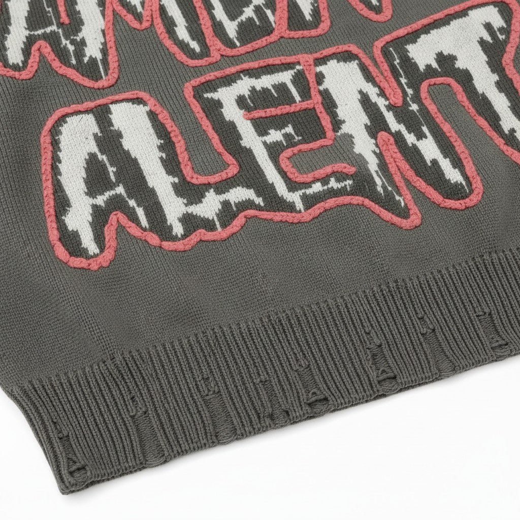 PAKSHI Y2K oversized grey knit sweater with distressed hem and white and pink graphic lettering detail