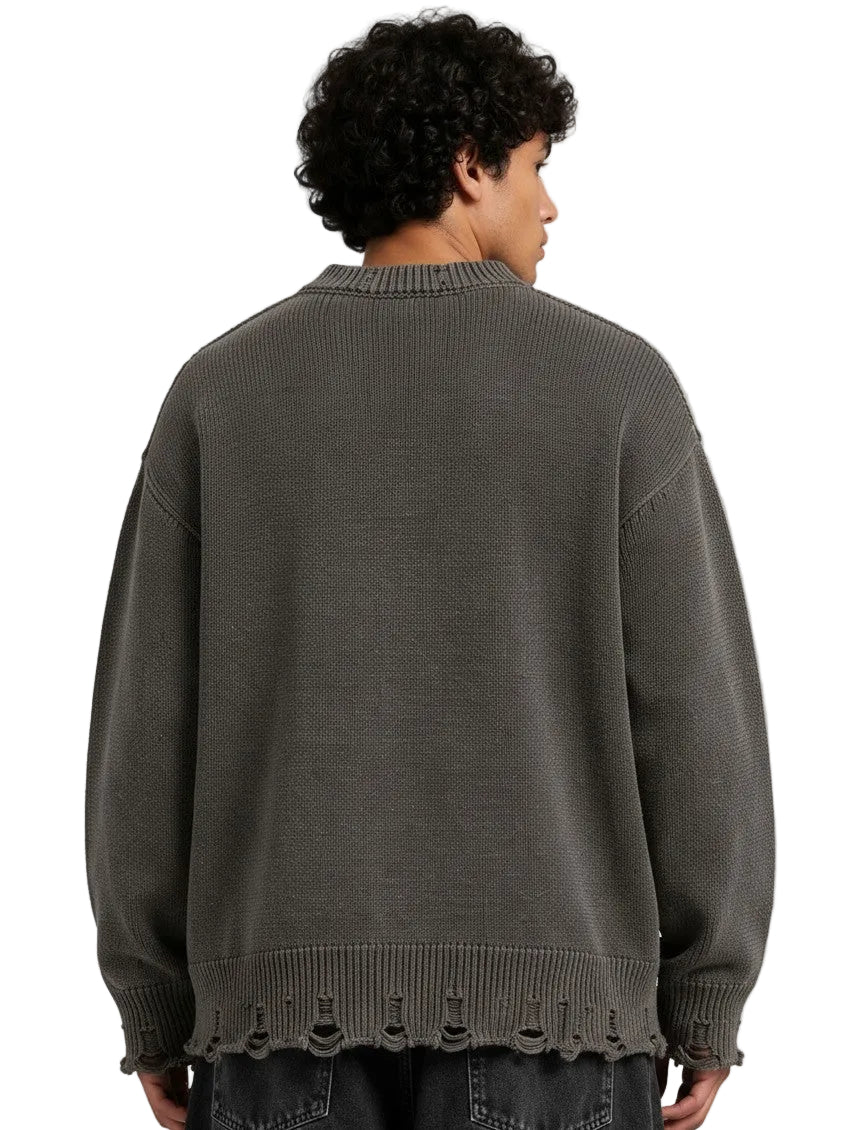 PAKSHI Y2K oversized grey knit sweater with distressed hem detail worn by a man, back view