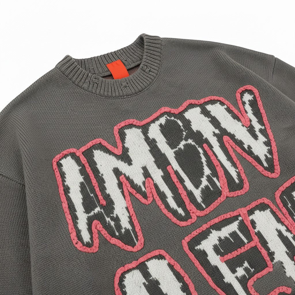 PAKSHI Y2K oversized grey knit sweater with pink-stitched graphic lettering and distressed crew neck detail