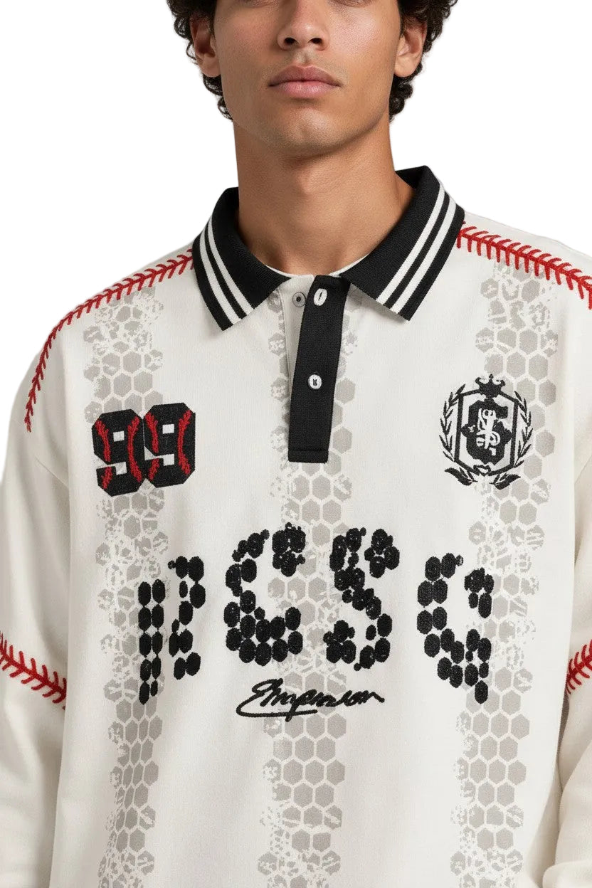 PAKSHI off-white long sleeve polo shirt featuring black striped collar, red baseball stitching, and graphic patches.