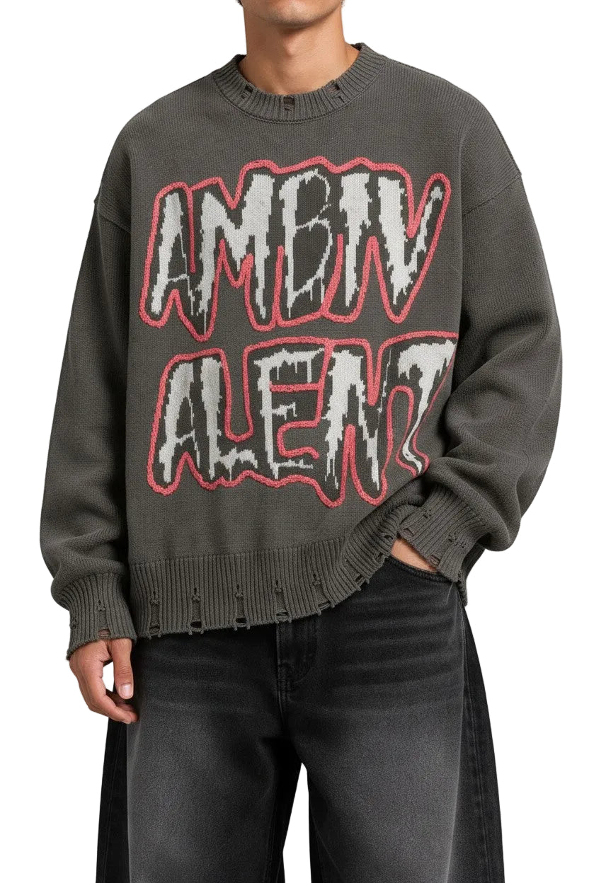 PAKSHI Y2K oversized grey knit sweater with distressed hem and bold graphic lettering on the chest