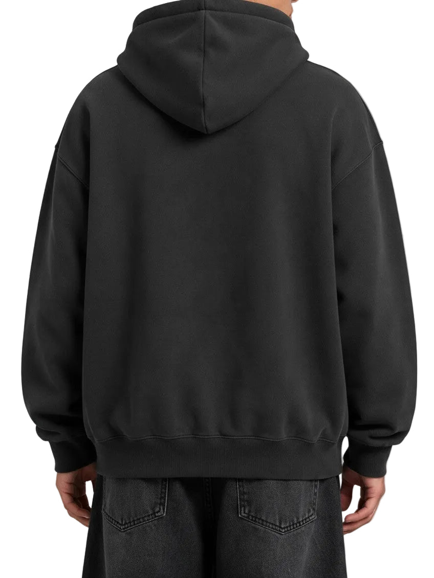PAKSHI oversized heavyweight charcoal grey hoodie worn by a model, back view showing relaxed fit and ribbed hem