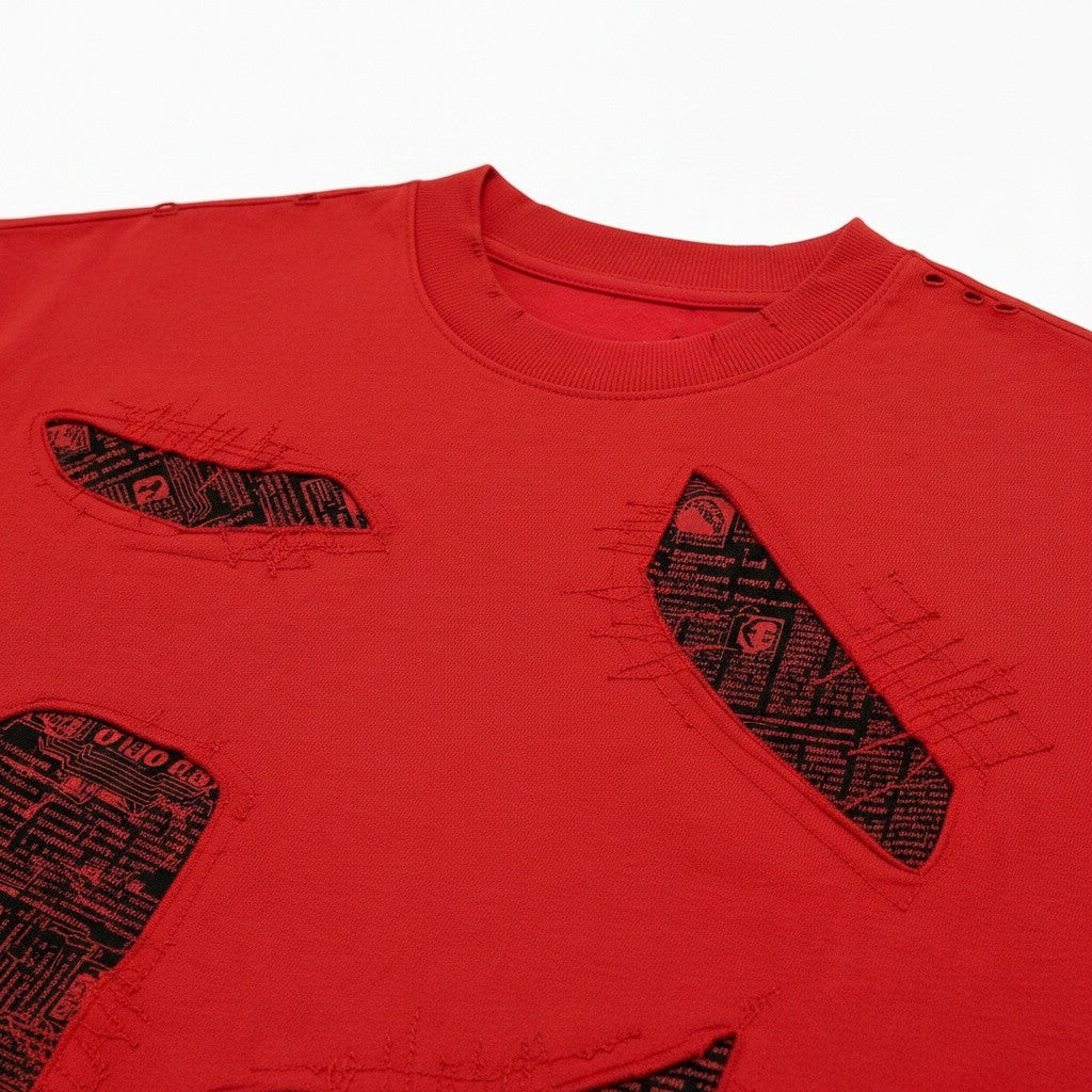 PAKSHI red patchwork distressed t-shirt with black graphic fabric inserts and raw edge stitching details